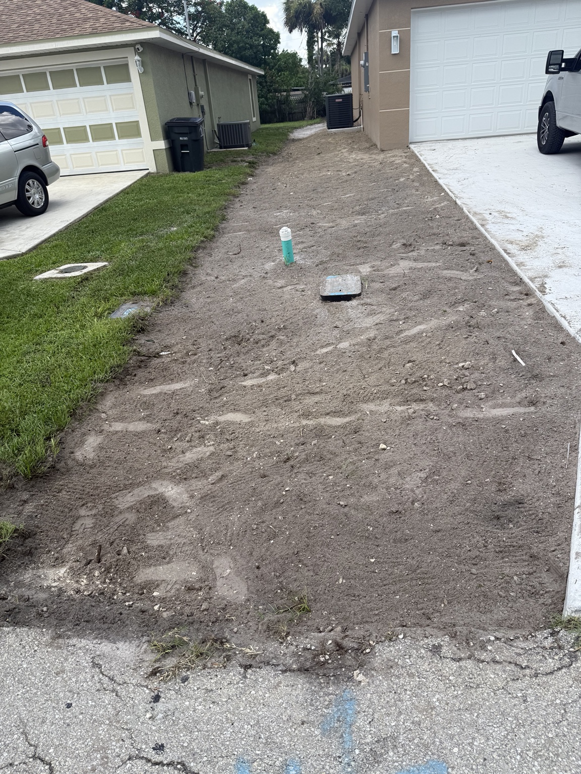 Driveway area prepared between two homes