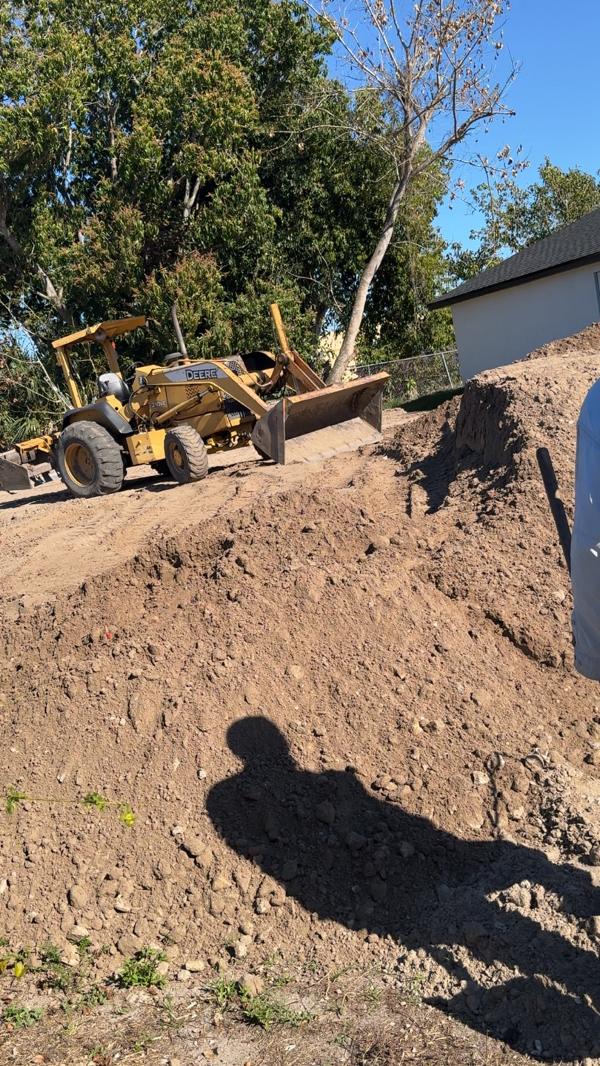 Heavy equipment performing grading work